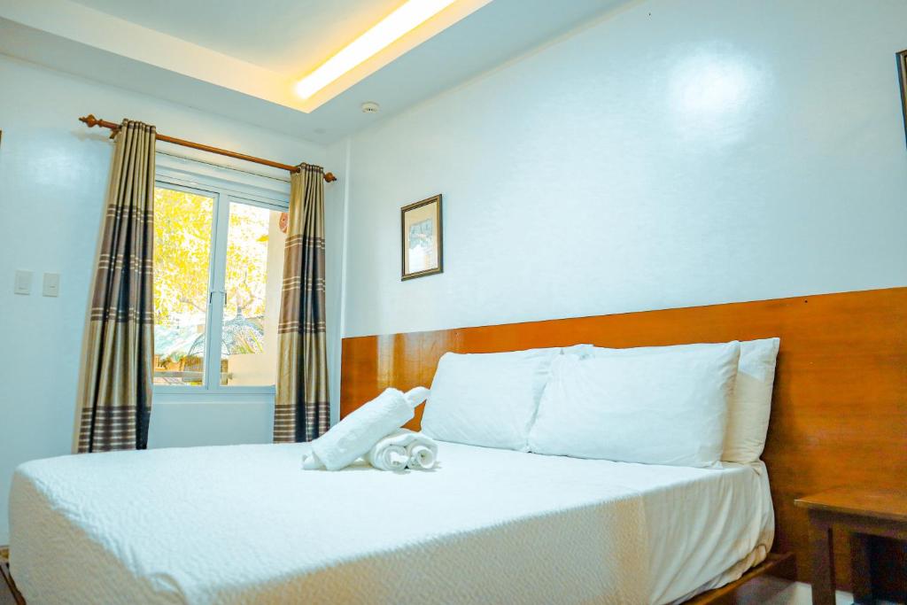 Postel nebo postele na pokoji v ubytování Youhan Beach Resort