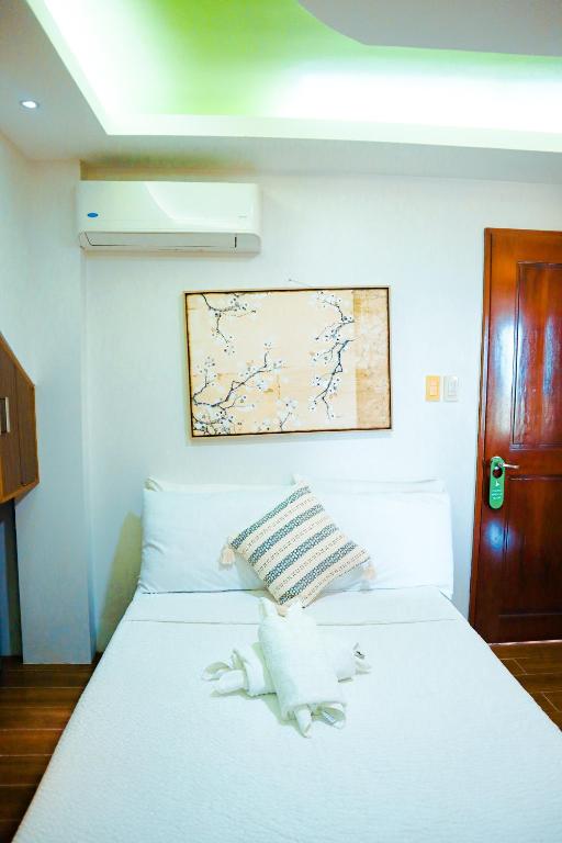 Postel nebo postele na pokoji v ubytování Youhan Beach Resort