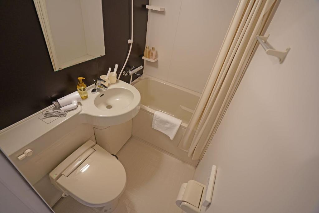 Koupelna v ubytování Plaza In Kanku Hotel