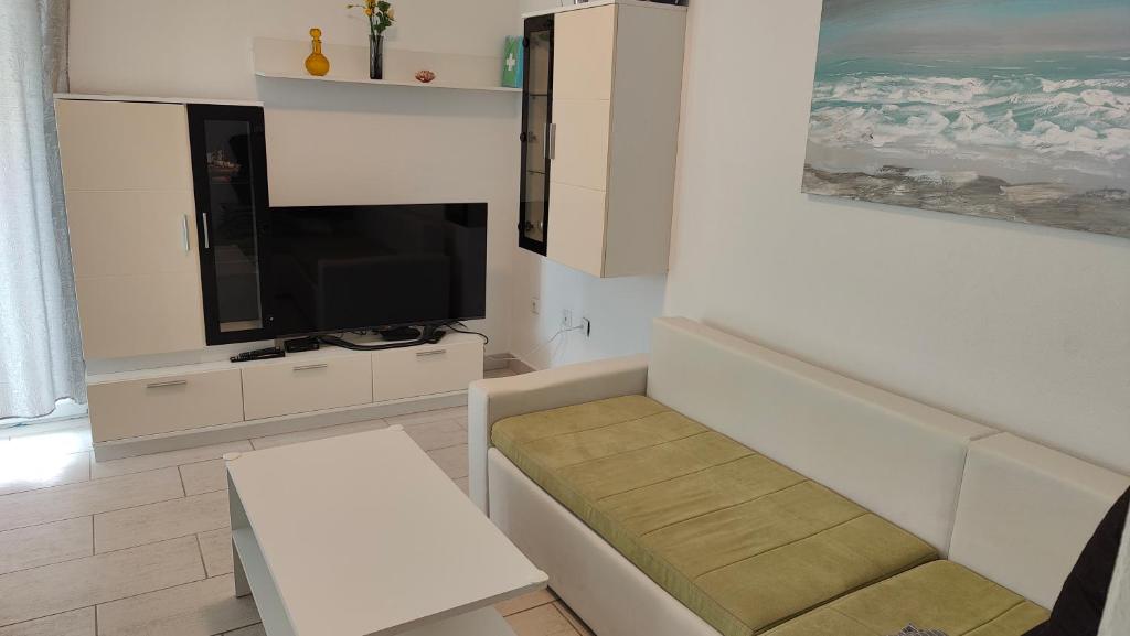 Televízia a/alebo spoločenská miestnosť v ubytovaní Villa Hodl