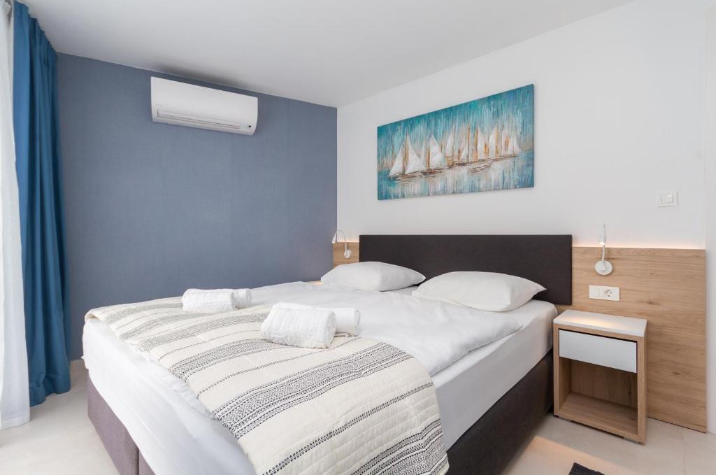 Postel nebo postele na pokoji v ubytování Garden Palace - Da Matteo Deluxe Apartment