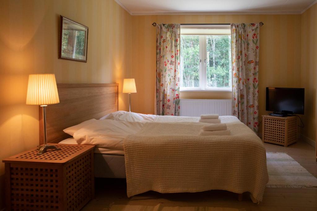Postel nebo postele na pokoji v ubytování Sikfors Gästhus