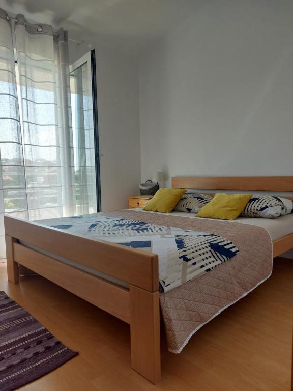 Postel nebo postele na pokoji v ubytování Apartment Dario