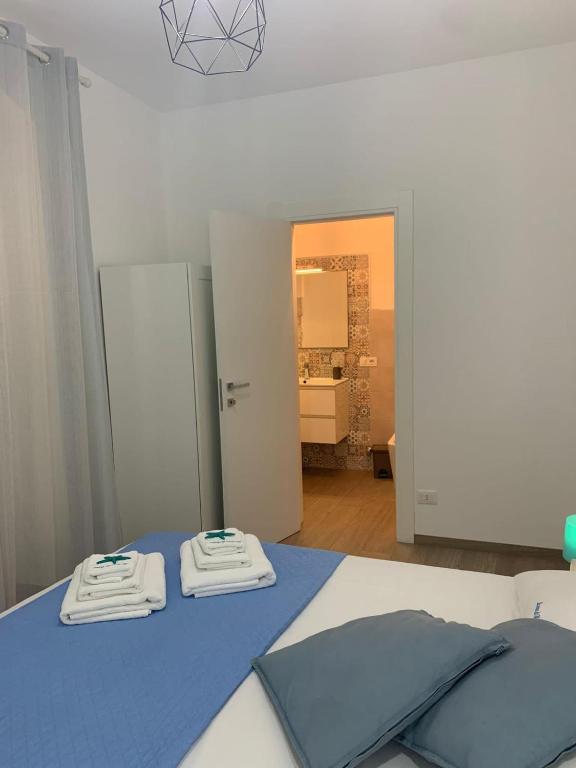 Łóżko lub łóżka w pokoju w obiekcie La casa di Nina