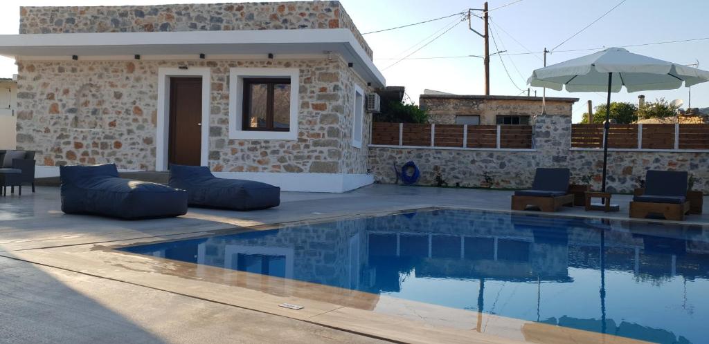 a villa with a swimming pool in a resort at Double Bee Villa with private pool in Agios Konstantinos