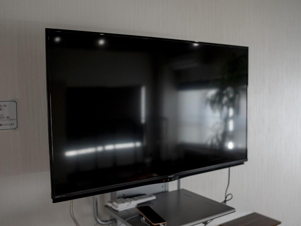 TV a/nebo společenská místnost v ubytování Tiz wan hotel