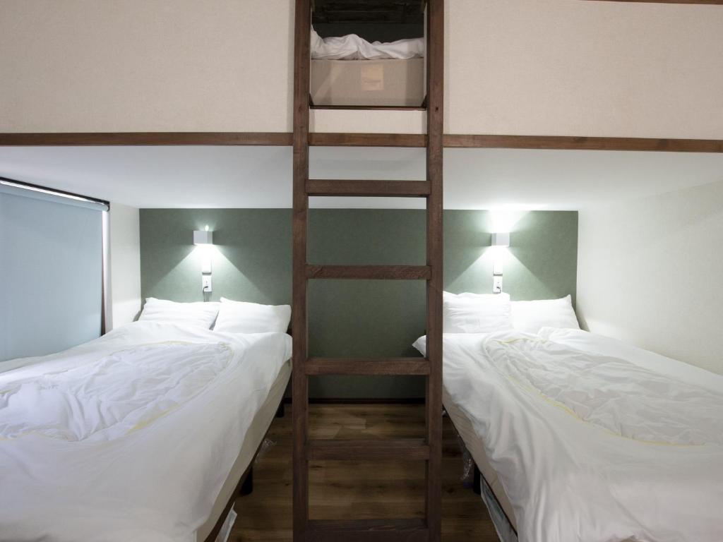 Postel nebo postele na pokoji v ubytování Tiz wan hotel