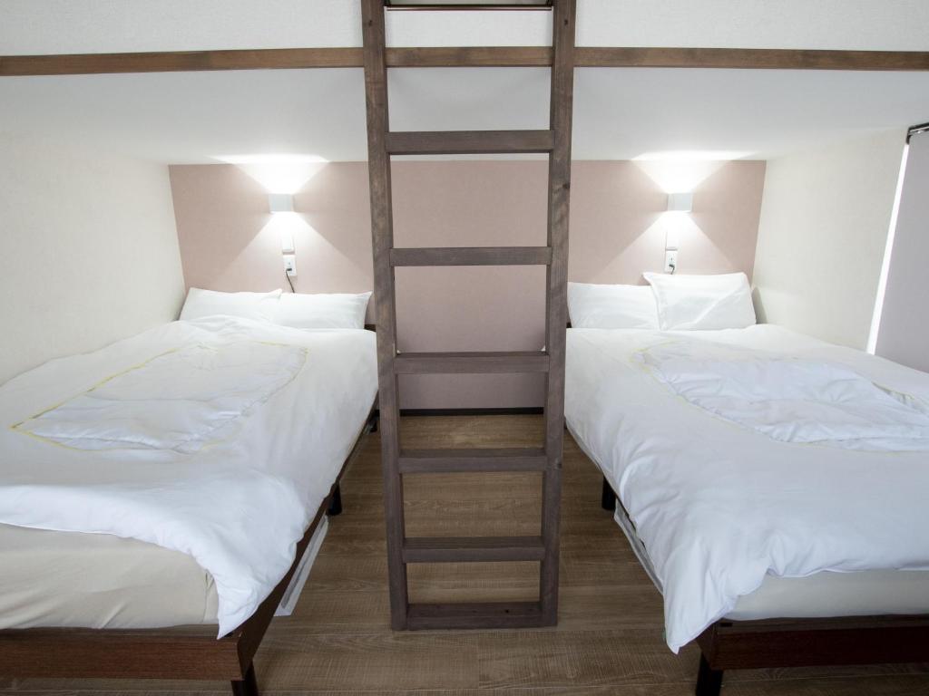 Postel nebo postele na pokoji v ubytování Tiz wan hotel