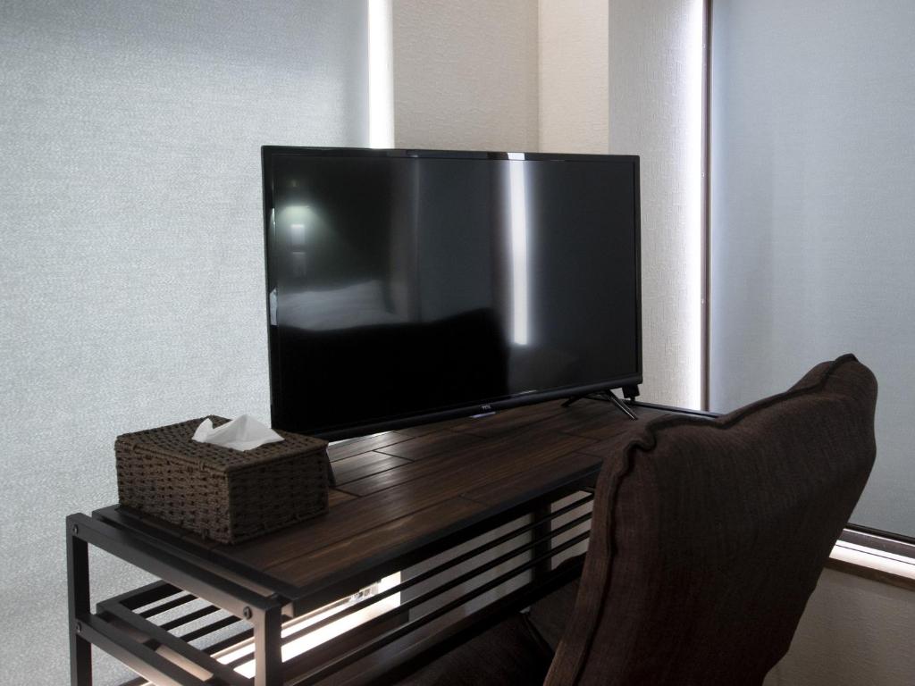 TV a/nebo společenská místnost v ubytování Tiz wan hotel