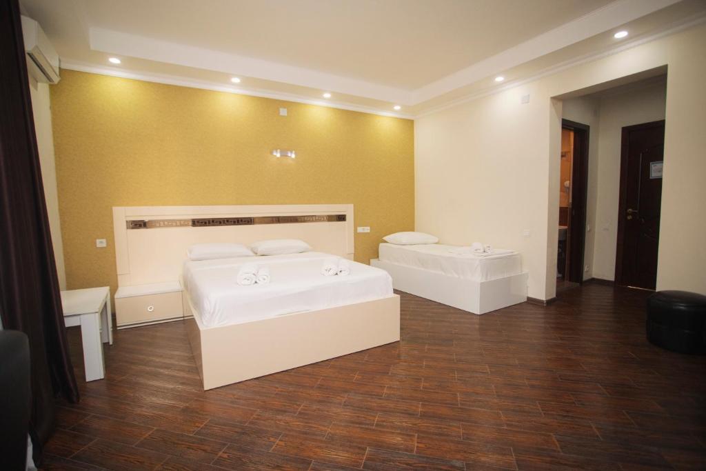 Ένα ή περισσότερα κρεβάτια σε δωμάτιο στο Hotel Irise