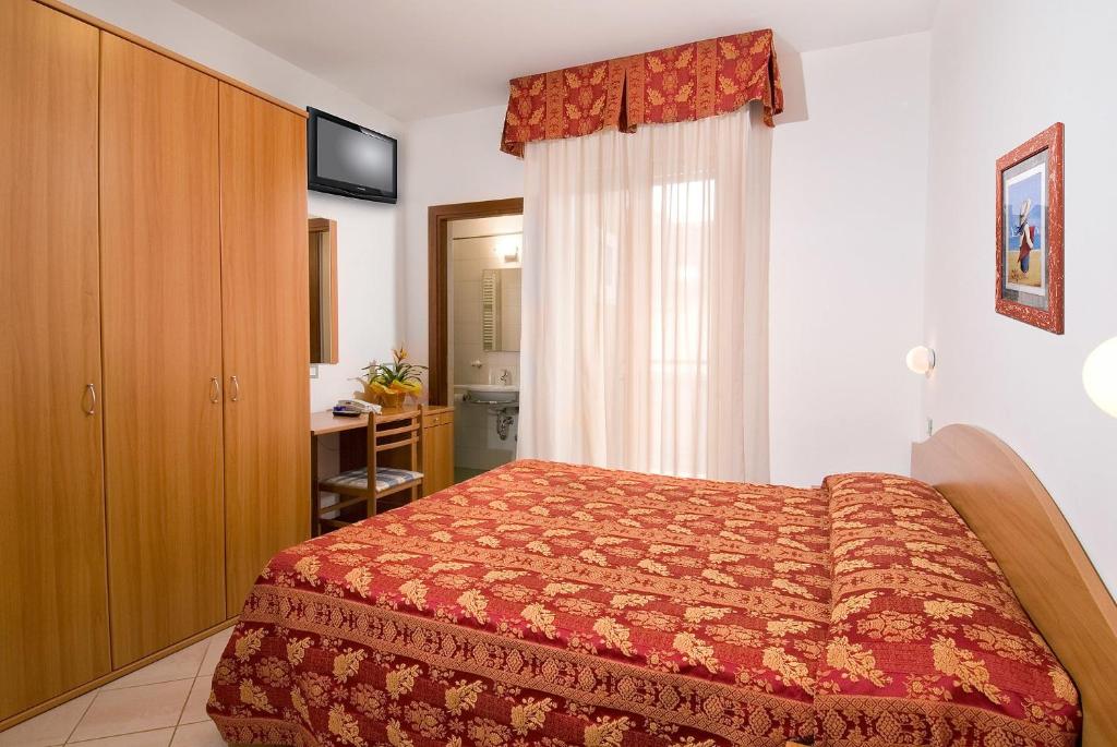 Postel nebo postele na pokoji v ubytování Hotel Belvedere