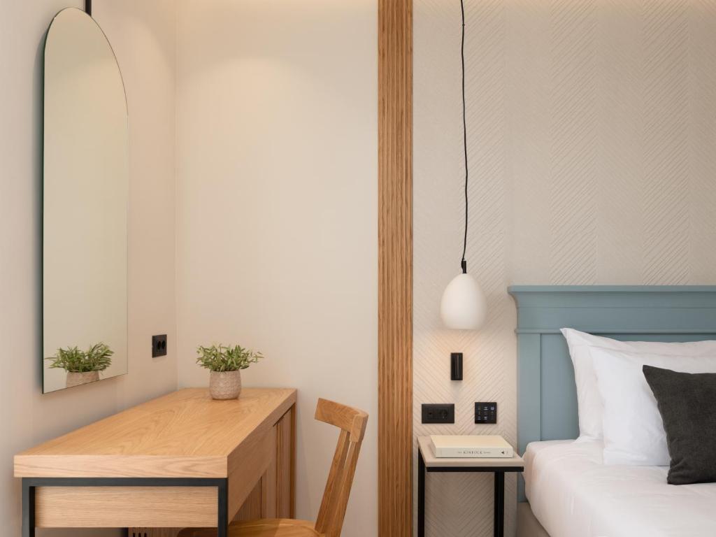 Postel nebo postele na pokoji v ubytování Hotel Ideon