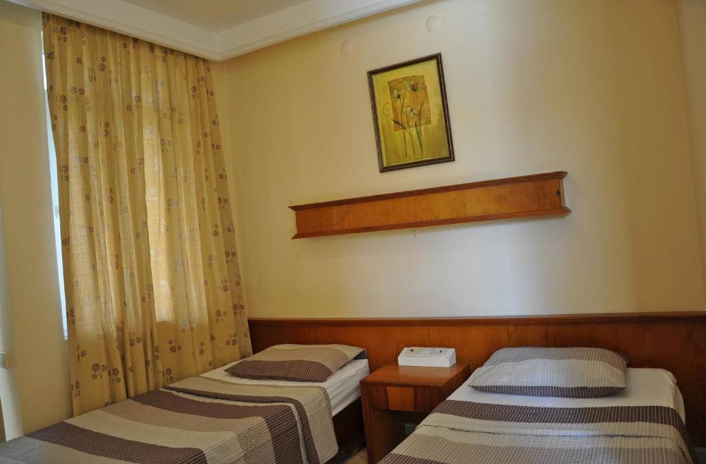 Postel nebo postele na pokoji v ubytování Tuncer Garden Hotel