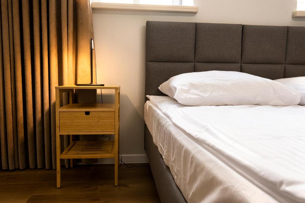 Postel nebo postele na pokoji v ubytování ORKANA House