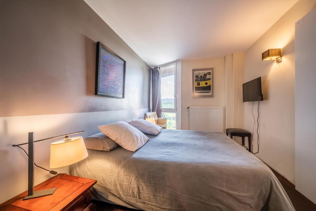 Posteľ alebo postele v izbe v ubytovaní Gîte Le Jorat - Studio