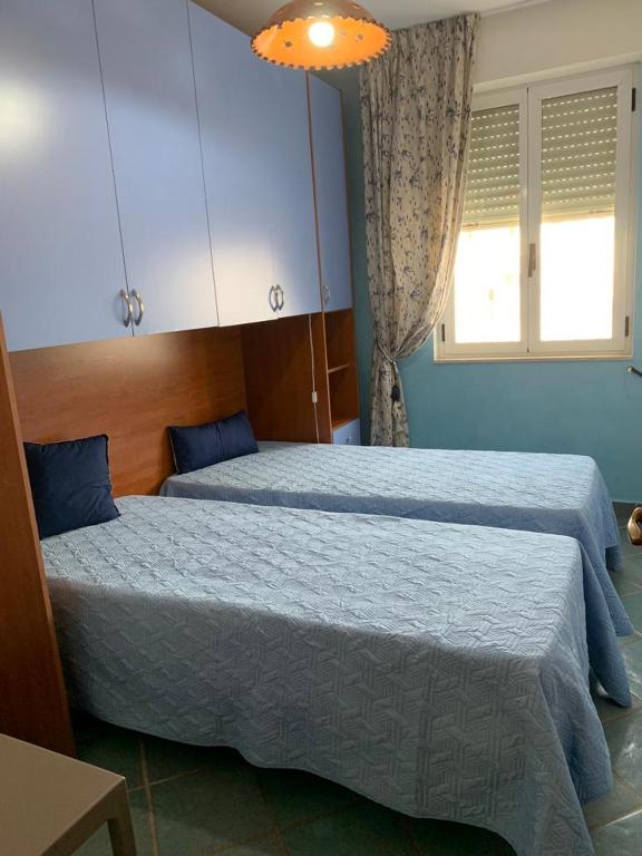Łóżko lub łóżka w pokoju w obiekcie Fronte Mare
