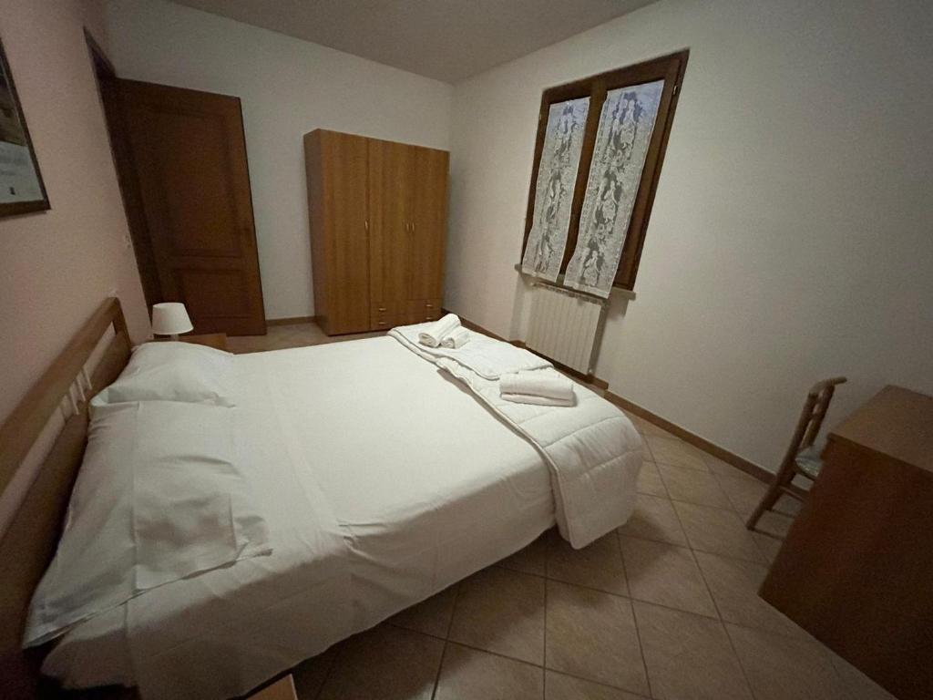 Postel nebo postele na pokoji v ubytování Residence San Francesco