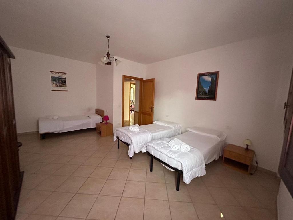 Postel nebo postele na pokoji v ubytování Residence San Francesco