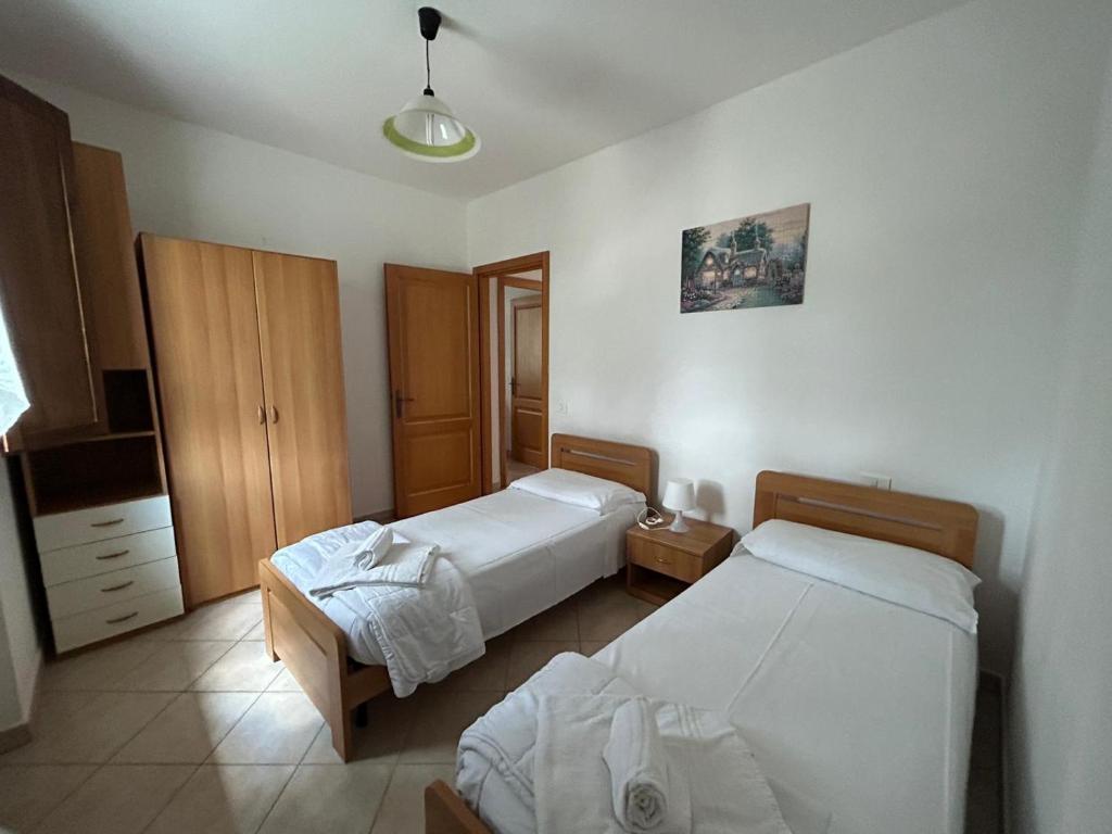 Postel nebo postele na pokoji v ubytování Residence San Francesco