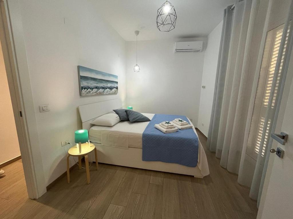 Łóżko lub łóżka w pokoju w obiekcie La casa di Nina