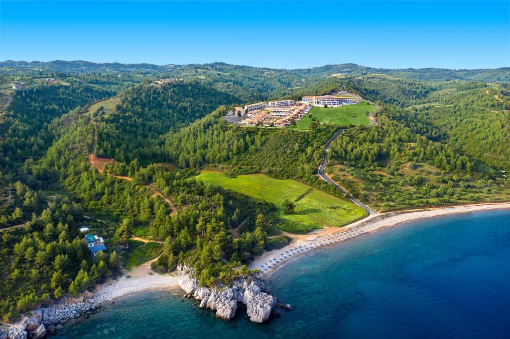 an aerial view of a beach and the ocean at Ajul Luxury Hotel & Spa Resort, a Registry Collection Hotel in Agia Paraskevi