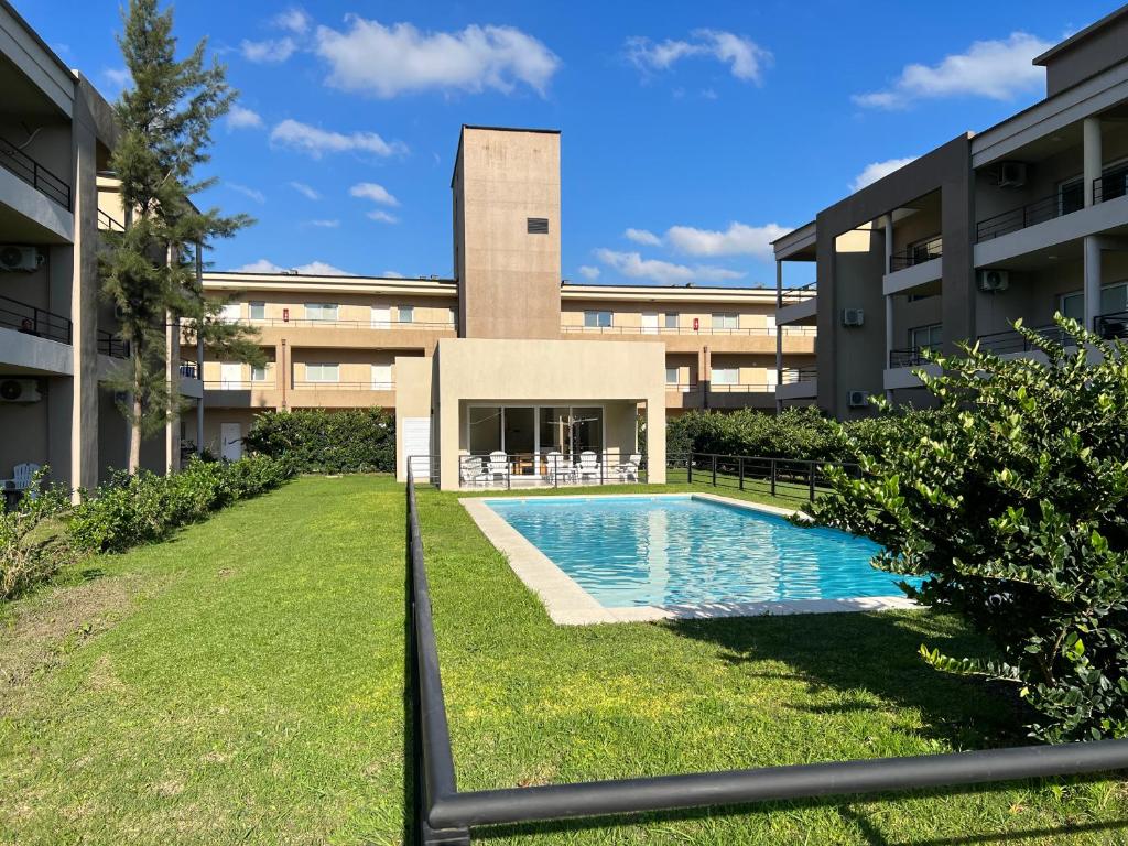 an external view of a building with a swimming pool at Va Pilar in Pilar