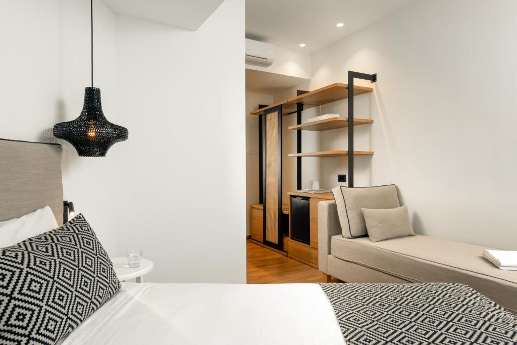 Postel nebo postele na pokoji v ubytování Hotel Ideon