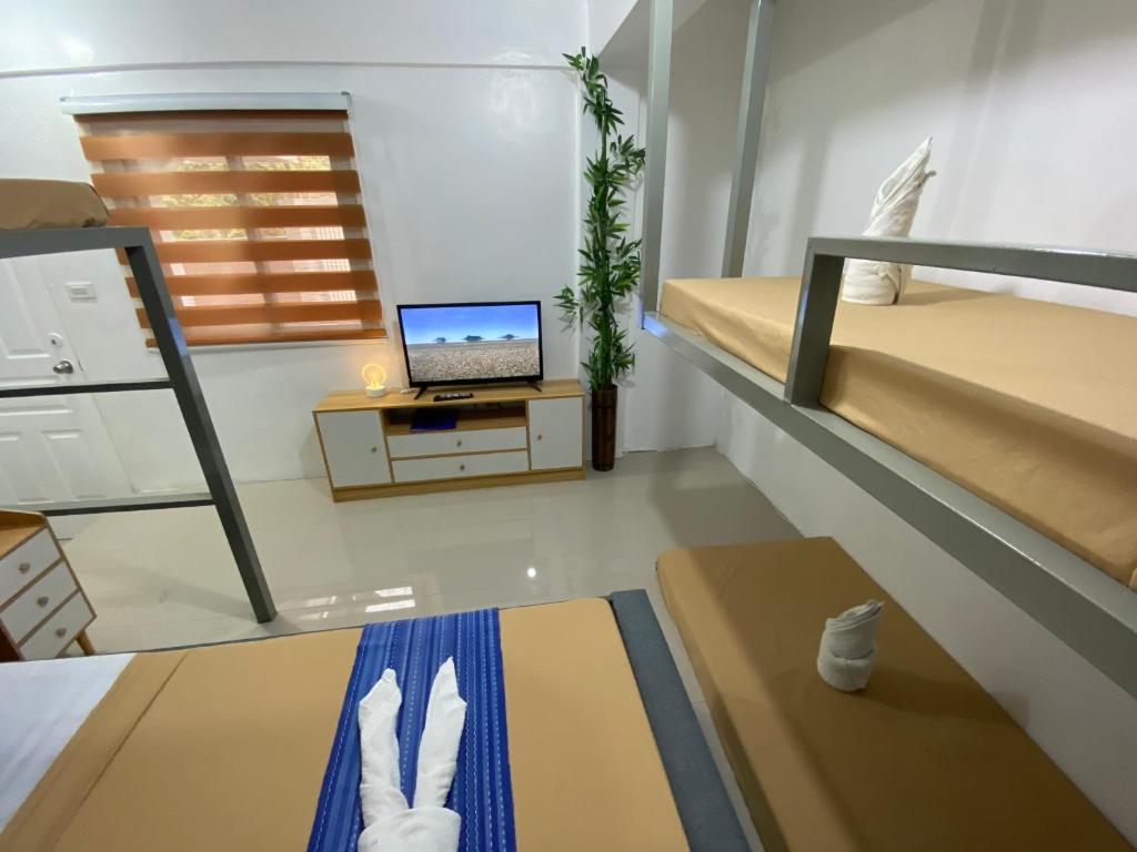 Postel nebo postele na pokoji v ubytování Prim Travellers Inn