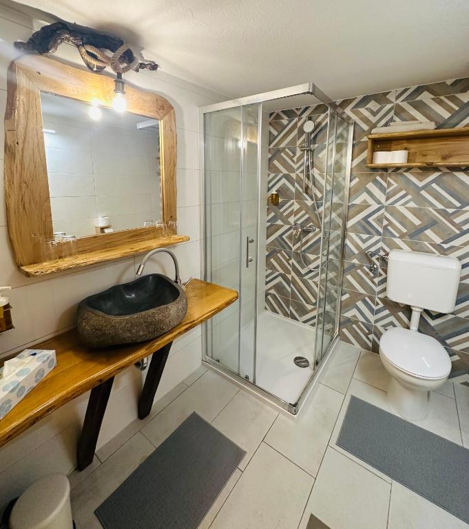 Koupelna v ubytování Rooms Murka