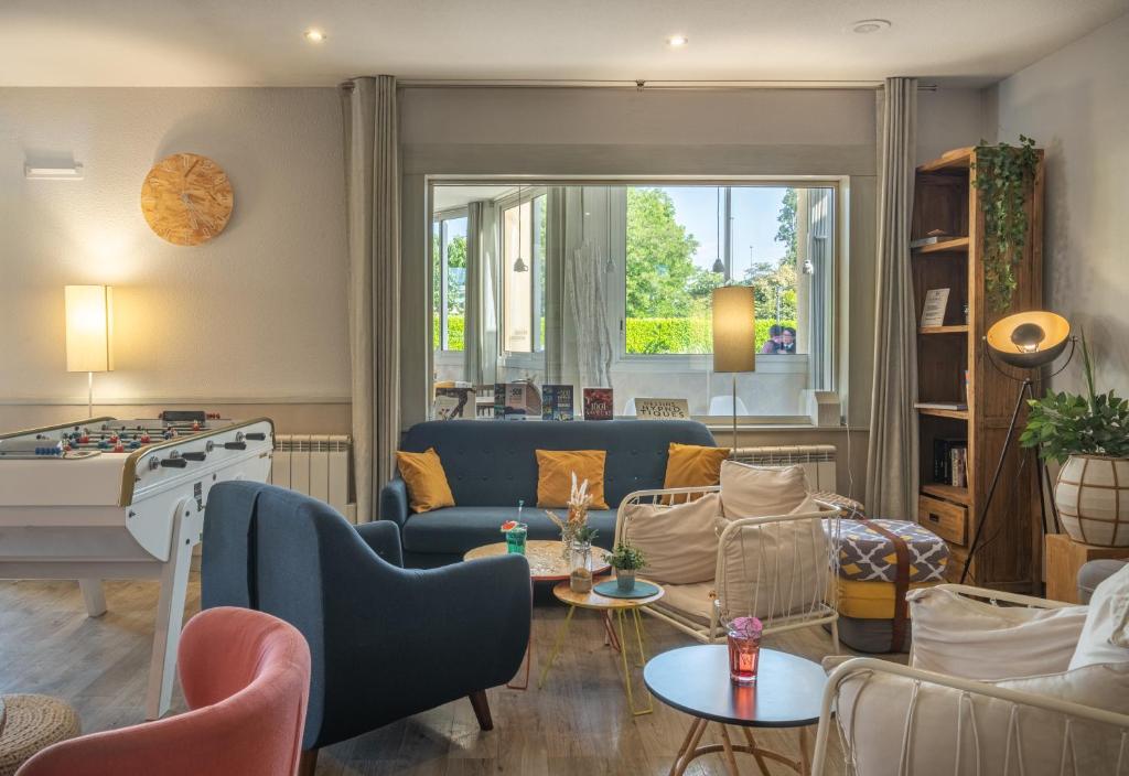 Posezení v ubytování Kyriad Lyon Est - Bron Eurexpo Le Cottage