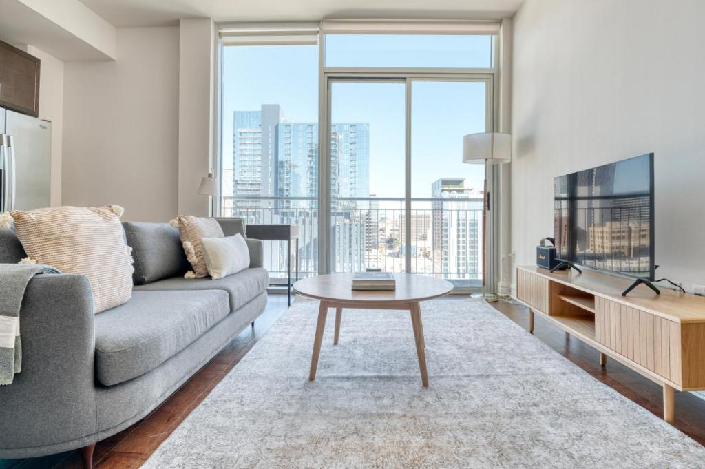 a living room with a couch and a table at Downtown Austin 1br w gym pool wd nr Capitol ATX-165 in Austin