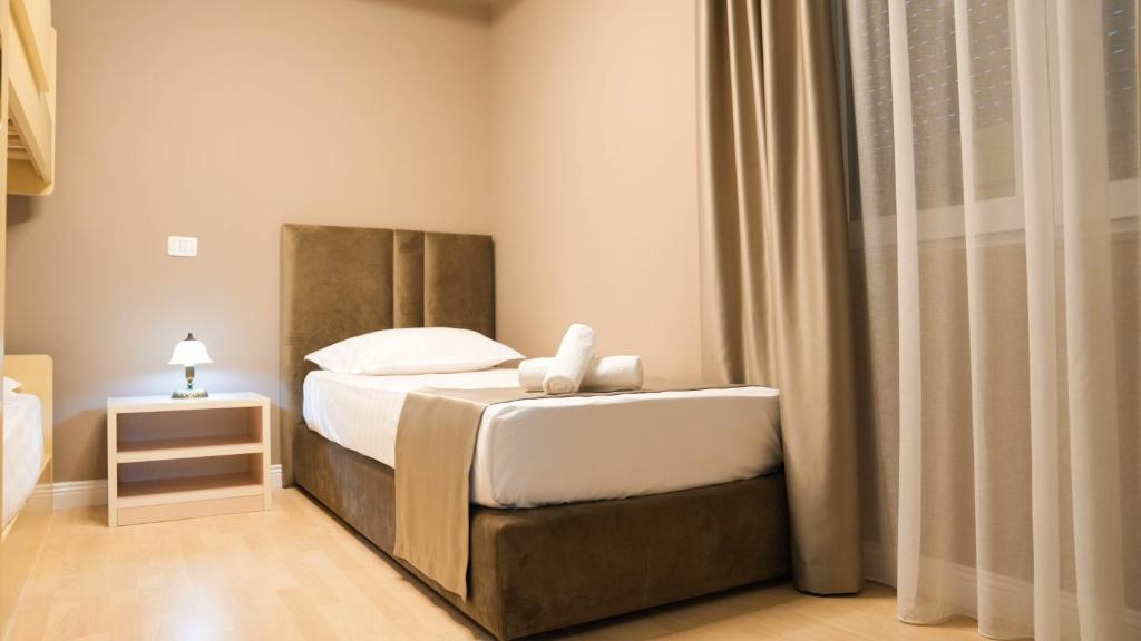 Postel nebo postele na pokoji v ubytování Hotel Majestic
