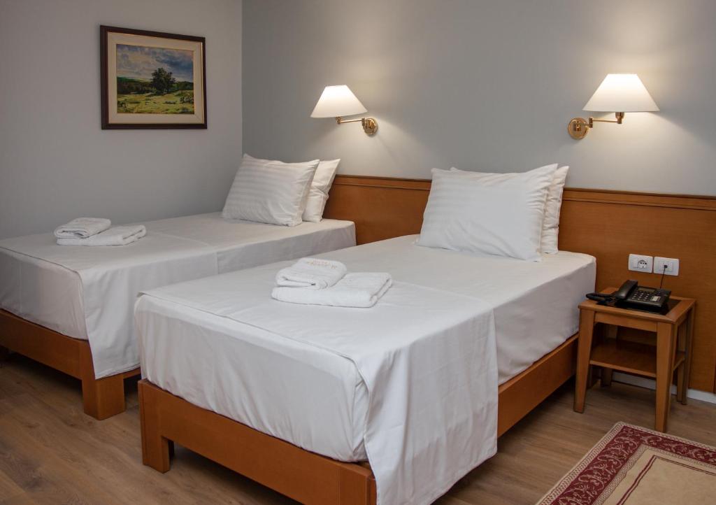 Postel nebo postele na pokoji v ubytování Arber Hotel
