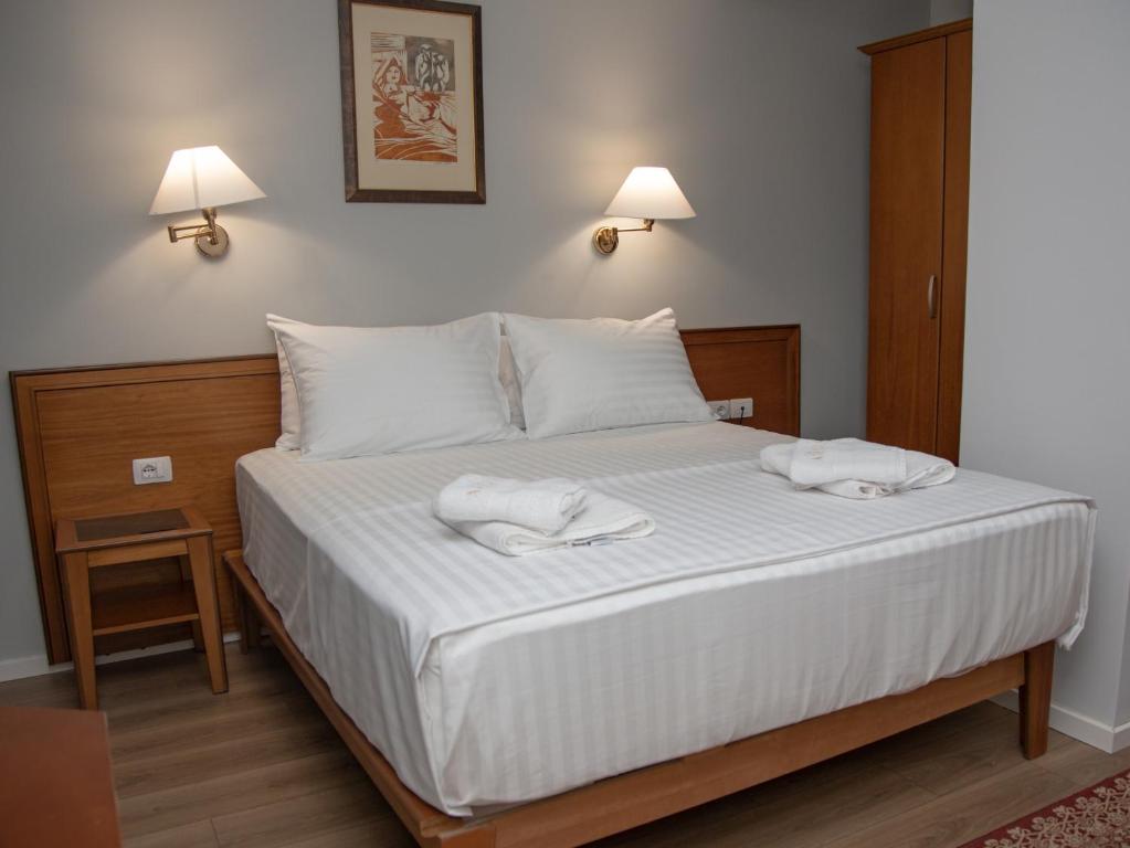 Postel nebo postele na pokoji v ubytování Arber Hotel