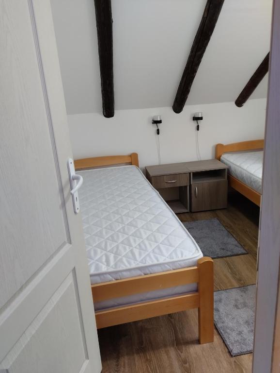 Postel nebo postele na pokoji v ubytování D&M Apartman Dojkinci