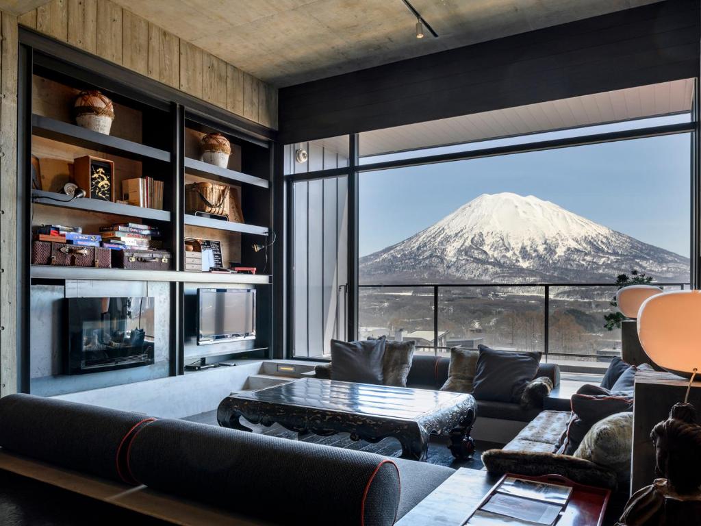 a living room with a view of a mountain at Suiboku in Niseko