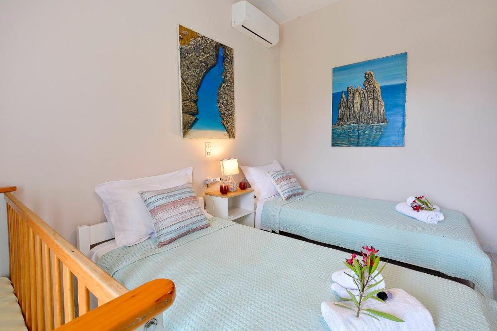 Postel nebo postele na pokoji v ubytování Ariadni Sidari Beach House