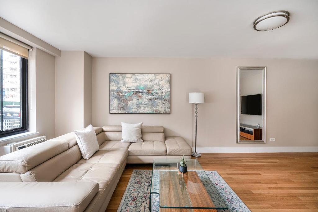 a living room with a couch and a table at 3 BR in Upper West Side in New York