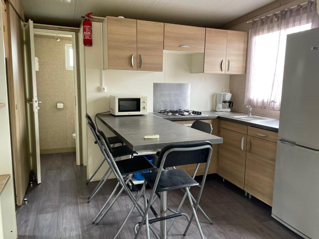 Kuchyň nebo kuchyňský kout v ubytování Camping Trinité