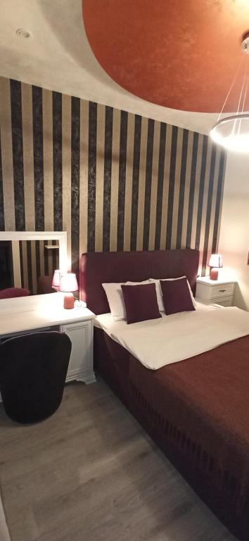 Ένα ή περισσότερα κρεβάτια σε δωμάτιο στο Apartmani President IV