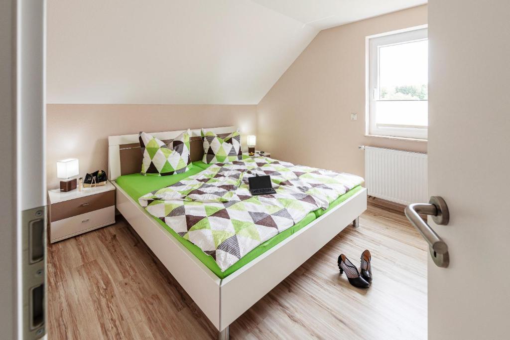 Postel nebo postele na pokoji v ubytování Ferienhaus Freya