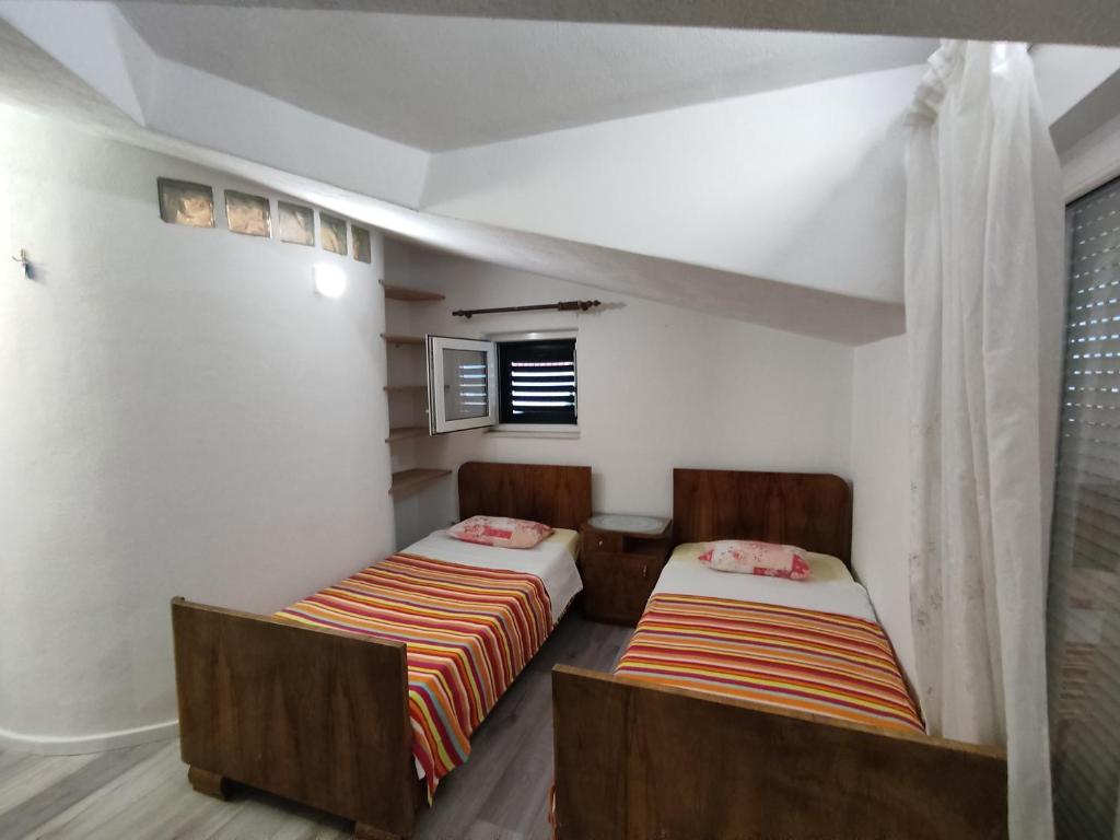 Postel nebo postele na pokoji v ubytování Guest House Periko