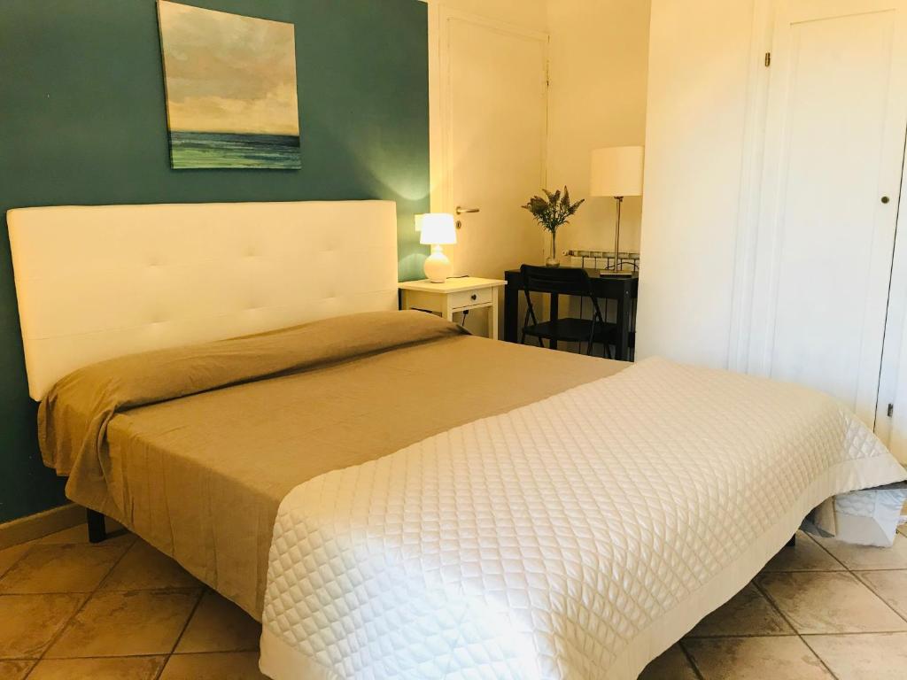 Postel nebo postele na pokoji v ubytování B&B L'albero di Melograno