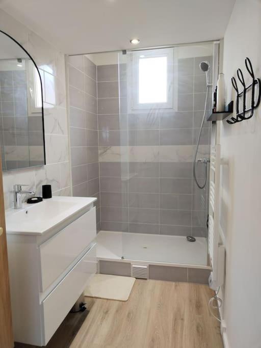 a white bathroom with a shower and a sink at Massilia Calling love Appartement de standing 8 personnes Marseille proche métro parking facile in Marseille