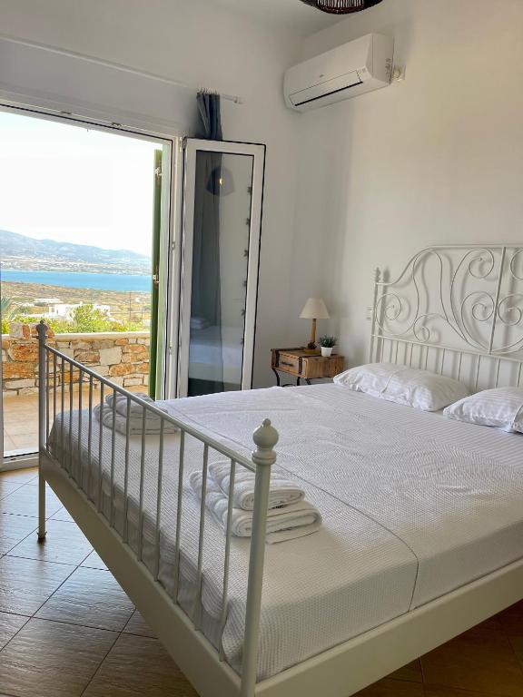 Postel nebo postele na pokoji v ubytování Gregos house