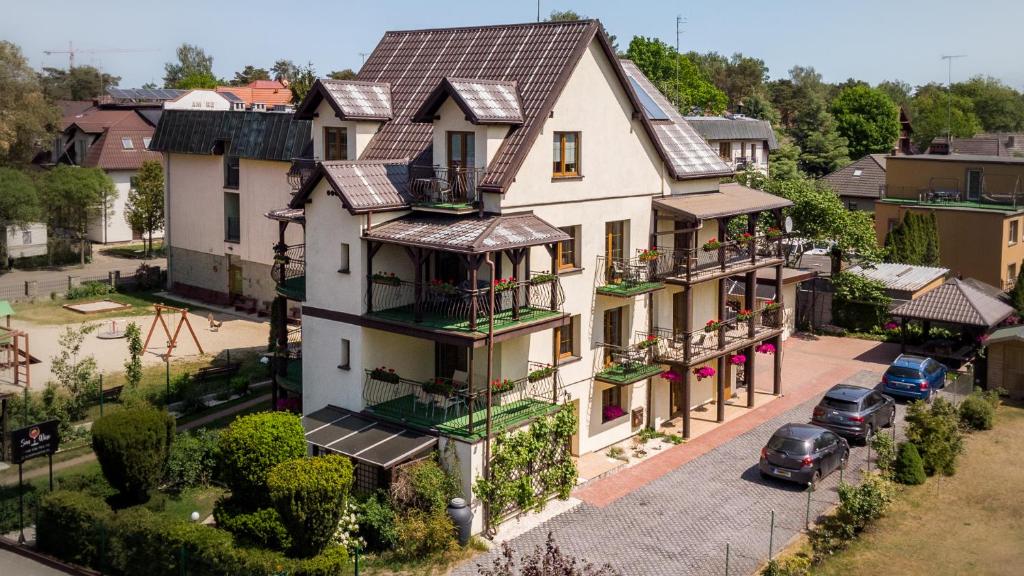 an overhead view of a house with a parking lot at SUN & WINE in Pobierowo