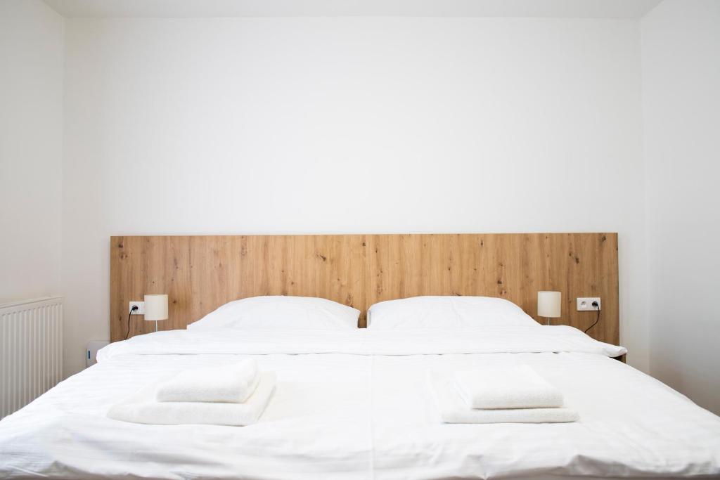 Postel nebo postele na pokoji v ubytování Amenity Penzion Horni Vestonice