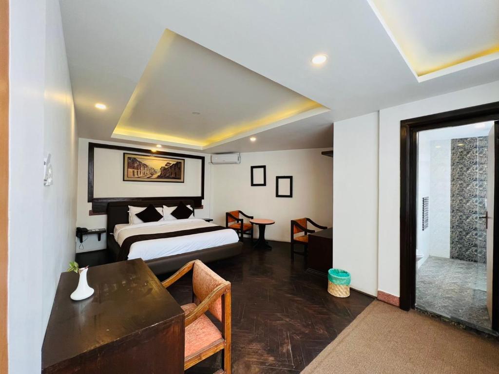 Postel nebo postele na pokoji v ubytování Durbar Hotel & Residence