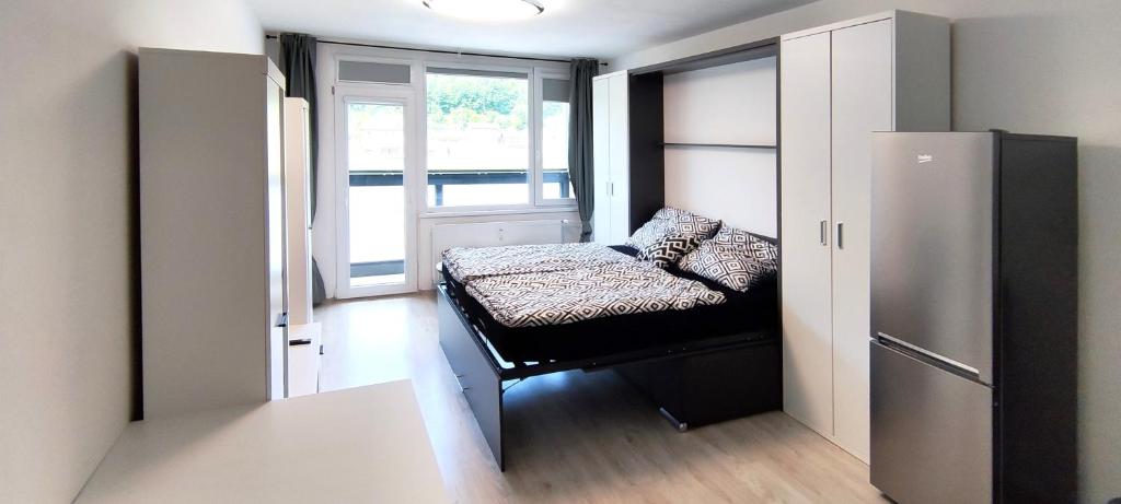 Postel nebo postele na pokoji v ubytování Útulný apartmán v centru, s krásným výhledem