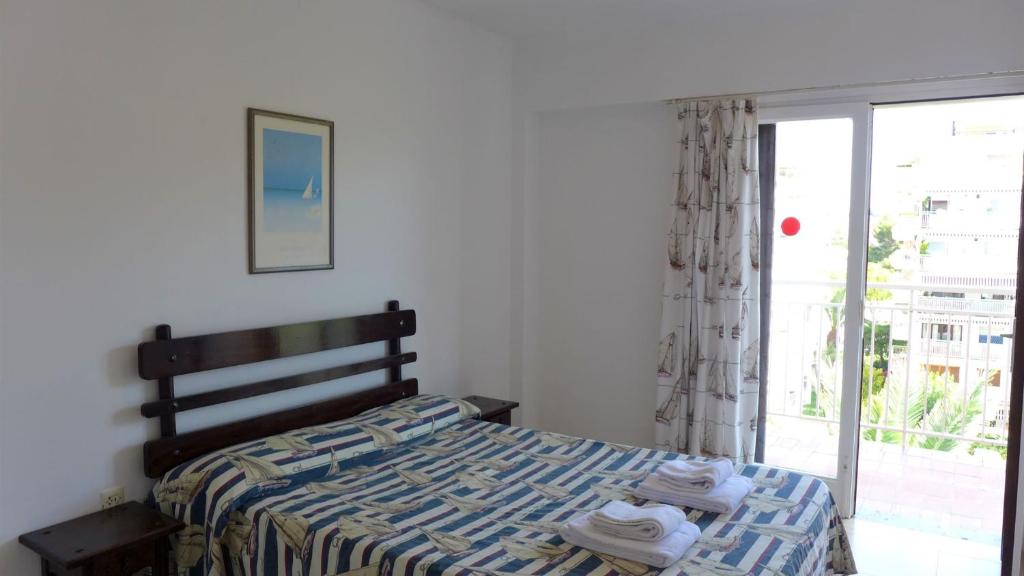 Postel nebo postele na pokoji v ubytování Apartamentos Flandria
